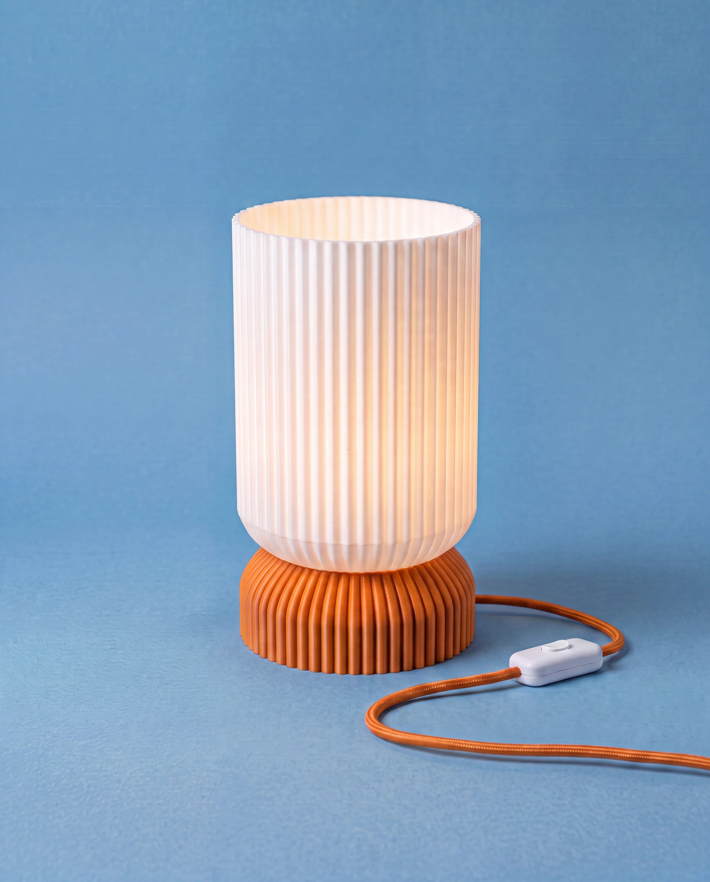 Luma 3D-printed table lamp with orange base