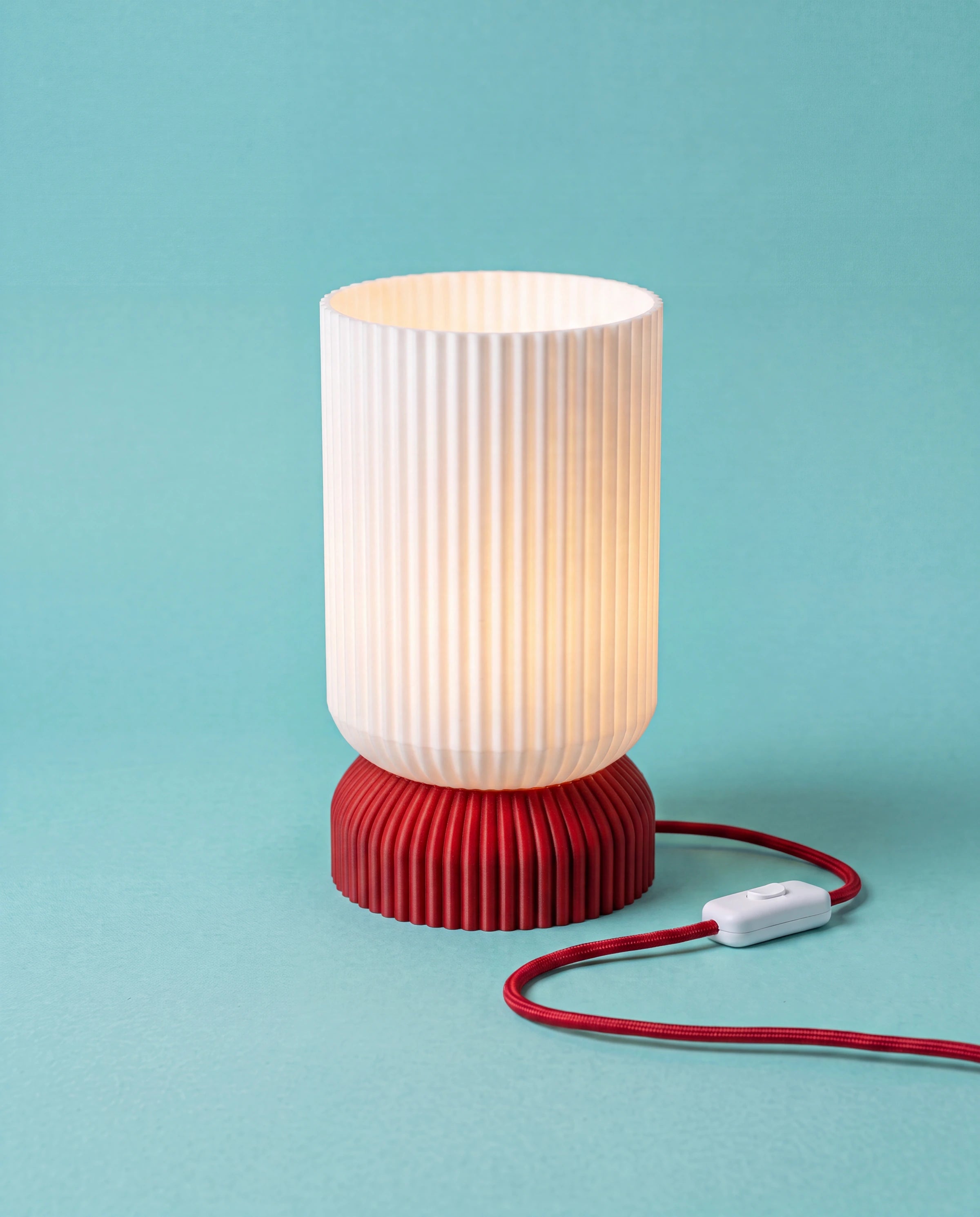 Luma 3D-printed table lamp with red base