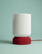 Luma 3D-printed table lamp, red base, studio shot
