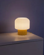Nubo table lamp lit at night on a side table