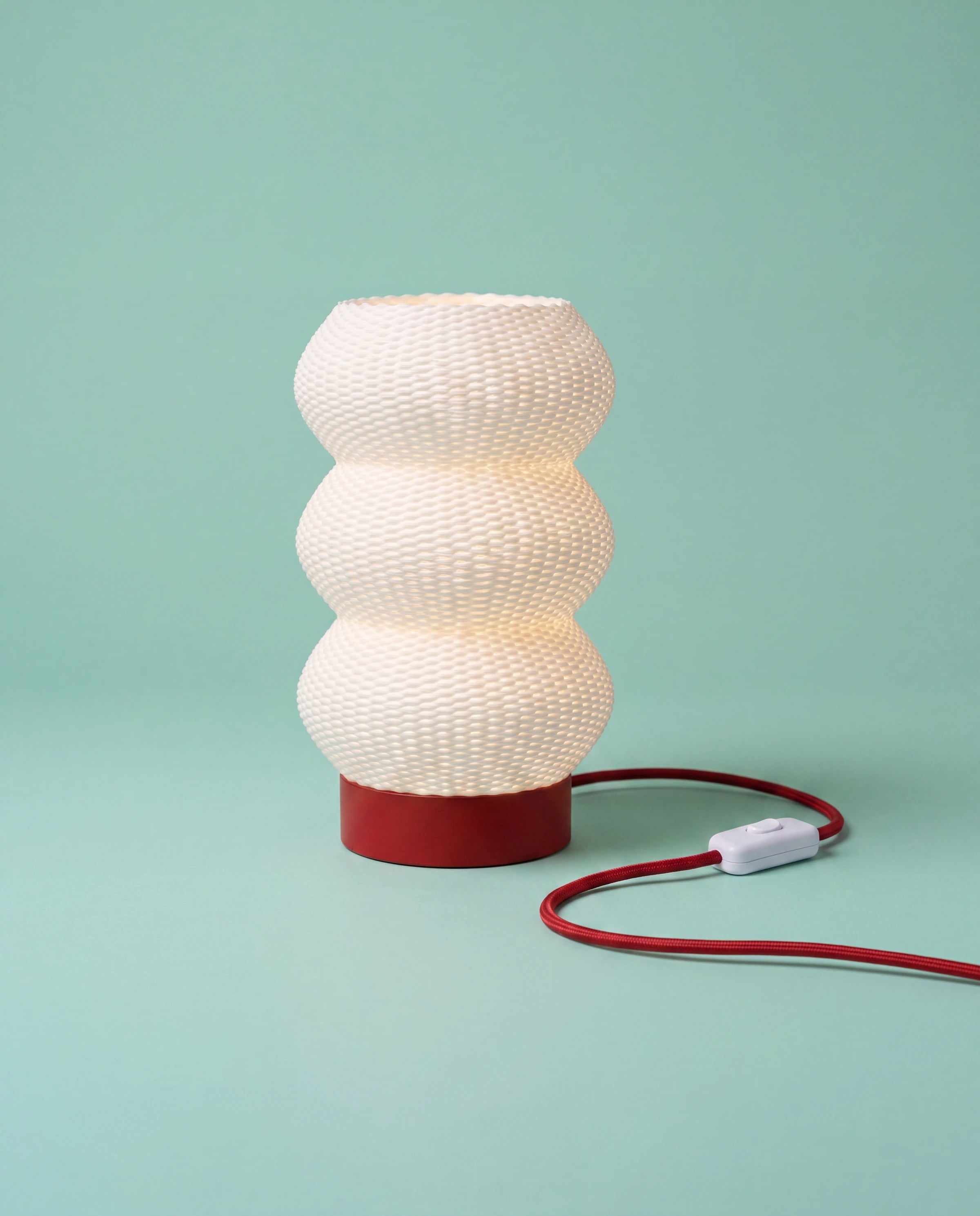 Soma 3D-printed table lamp with red base