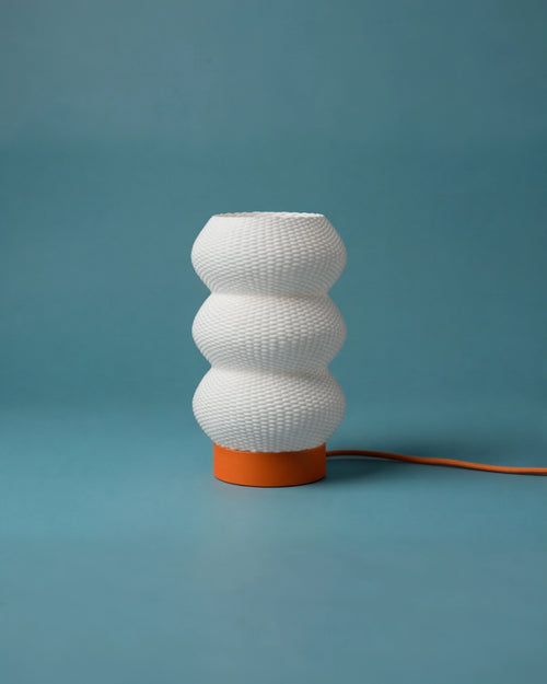 Soma 3D-printed table lamp, orange base, studio shot