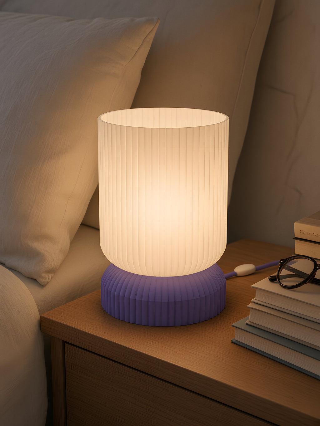 Luma switched on, on a crowded bedside table