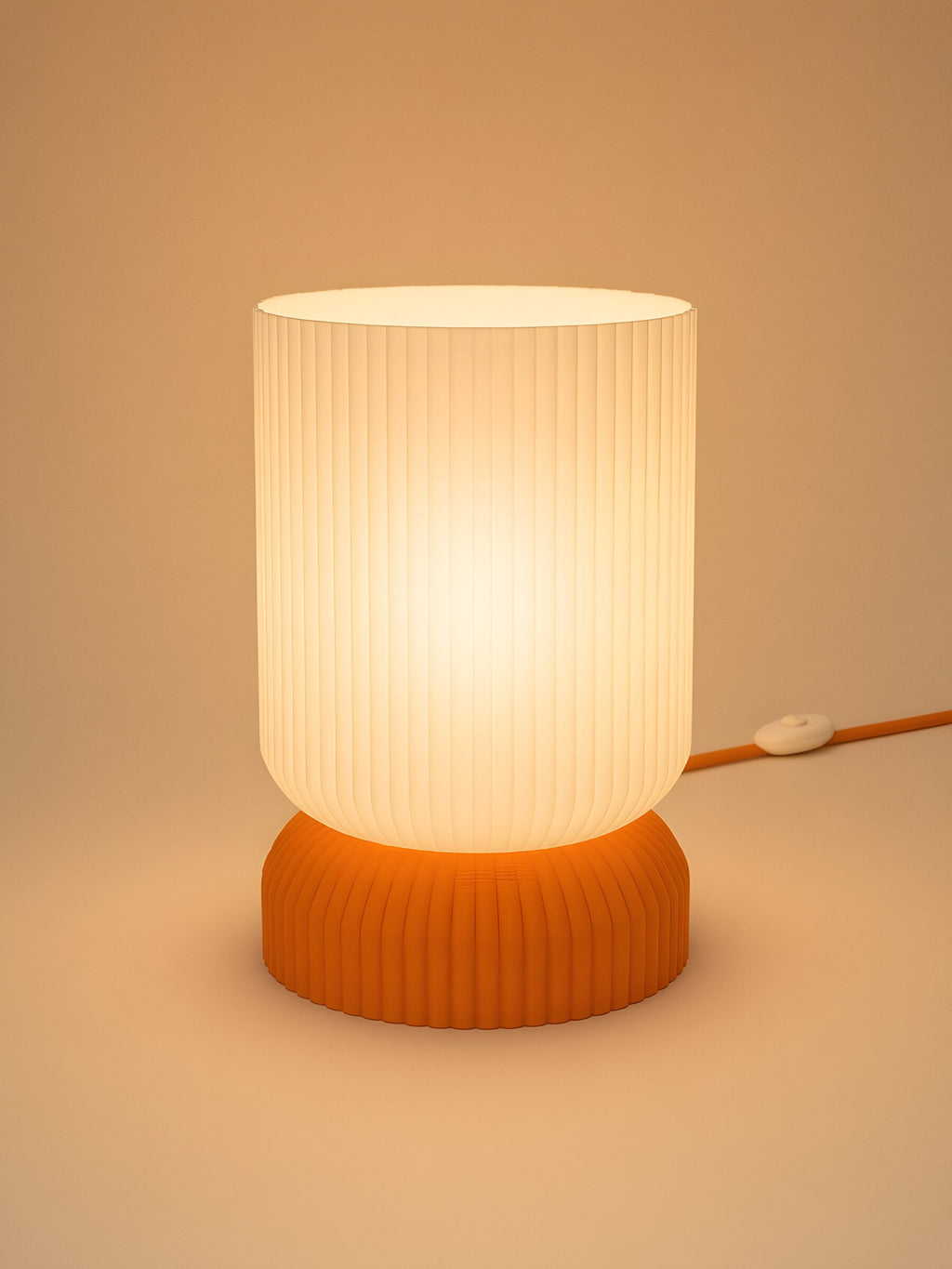 Luma in Orange: switched on, studio photo