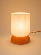 Luma in Orange: switched on, studio photo