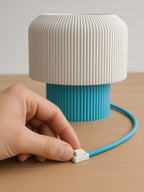 Nubo in Light Blue: white switch on the braided cable