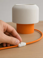 Nubo in Orange: white switch on the braided cable